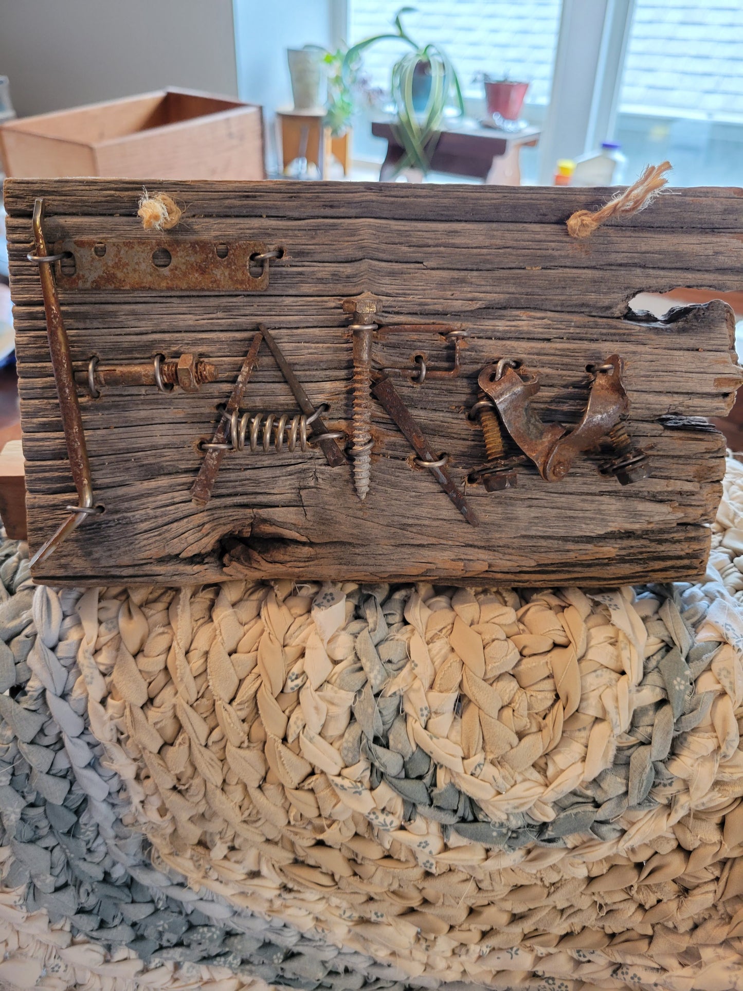 This sign is one-of-a-kind made with found metal objects that spell "Farm" on reclaimed barn wood. When you order this sign it will be as similar as possible to this one, but it will be a separate, unique piece.