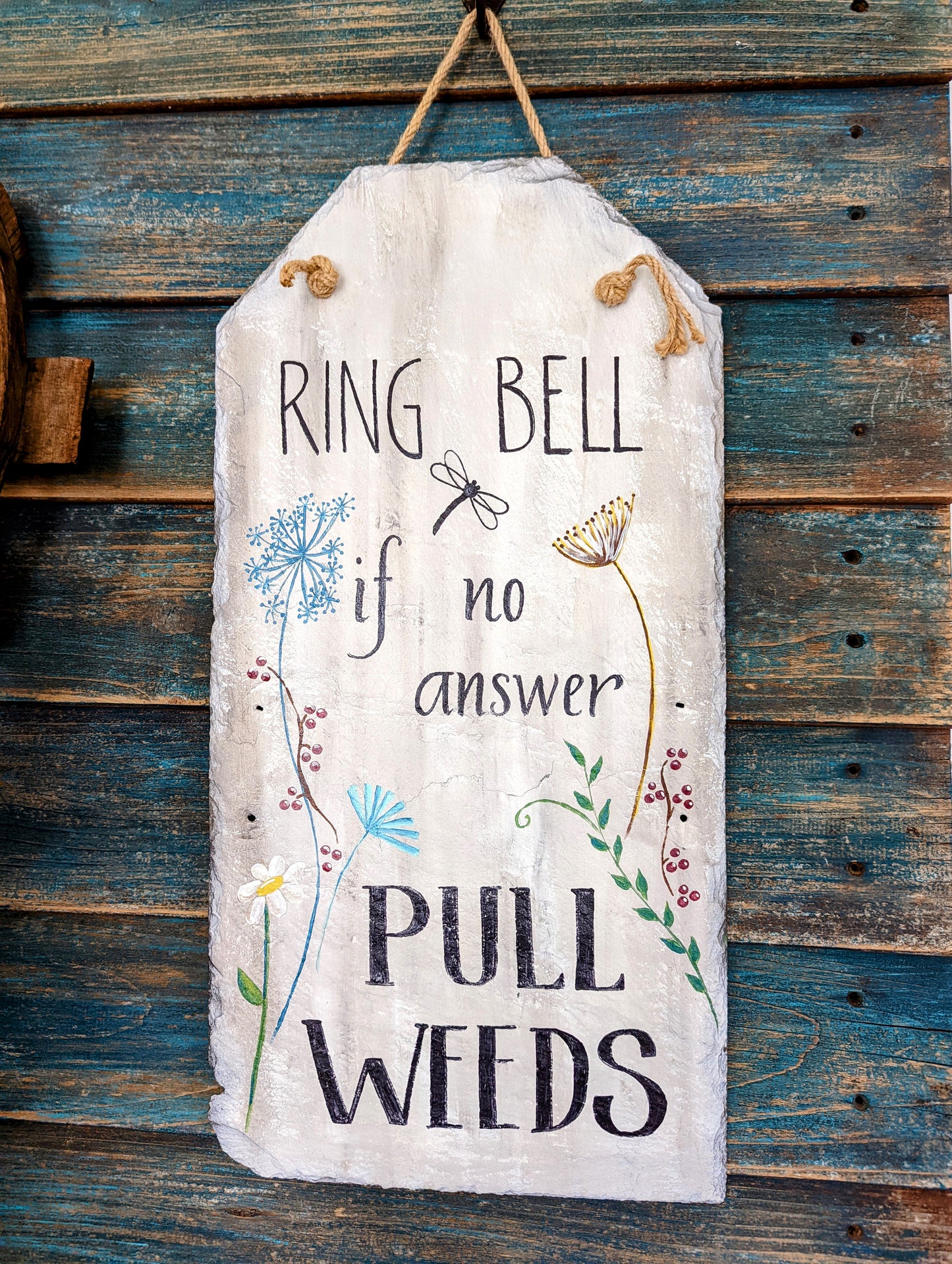 "Ring bell. If no answer, pull weeds." Hand painted slate sign with jute rope hanger and flowers and dragonfly.