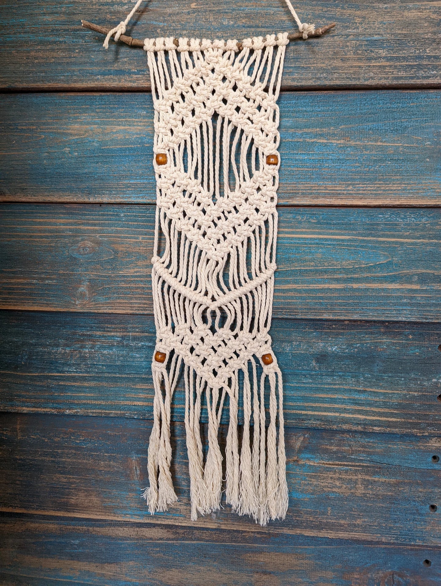 Create this beautiful macramé wall hanging! Includes dowel rod and beads.