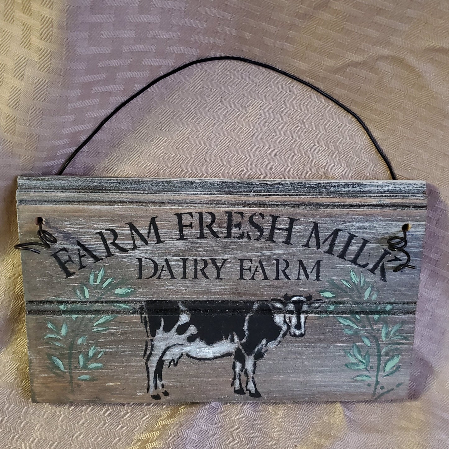 The Farm Fresh Milk Dairy Farm sign will make a delightful addition to your farmhouse kitchen with its happy little cow and florals. wire hanger adds another dimension versus regular picture hanger. Adorable small size 5" x 10"