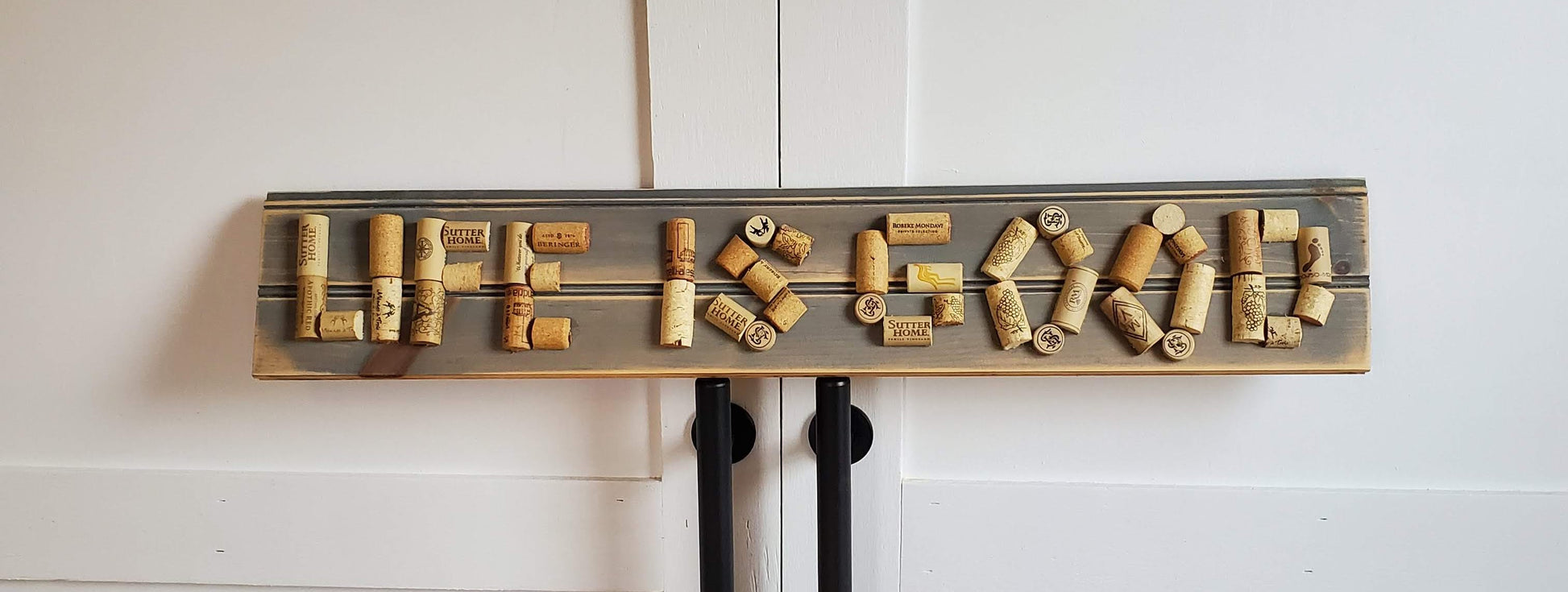 Life is Good! A bead board sign with gray wash. "Life is Good" spelled with wine corks.