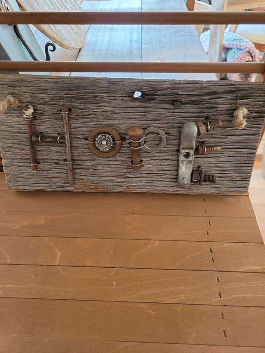 Found metal objects that spell "Hope" on reclaimed barn wood. 12.5" x 6"