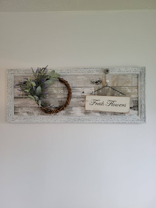 Large frame with wood pattern background, lavender wreath, "Fresh Flowers" sign