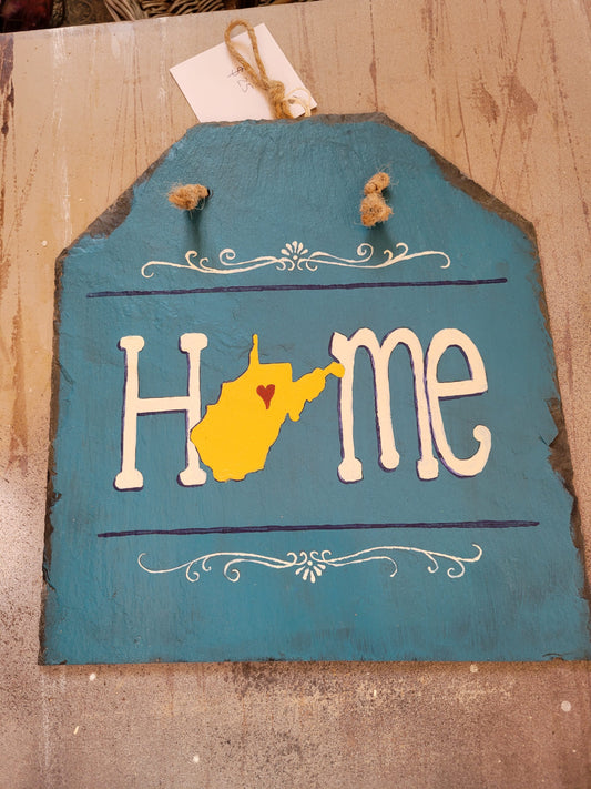 Hand painted natural slate sign, cut into five sided shape, blue background, "Home" with WV outline and organic filigree designs, 12" x 11"