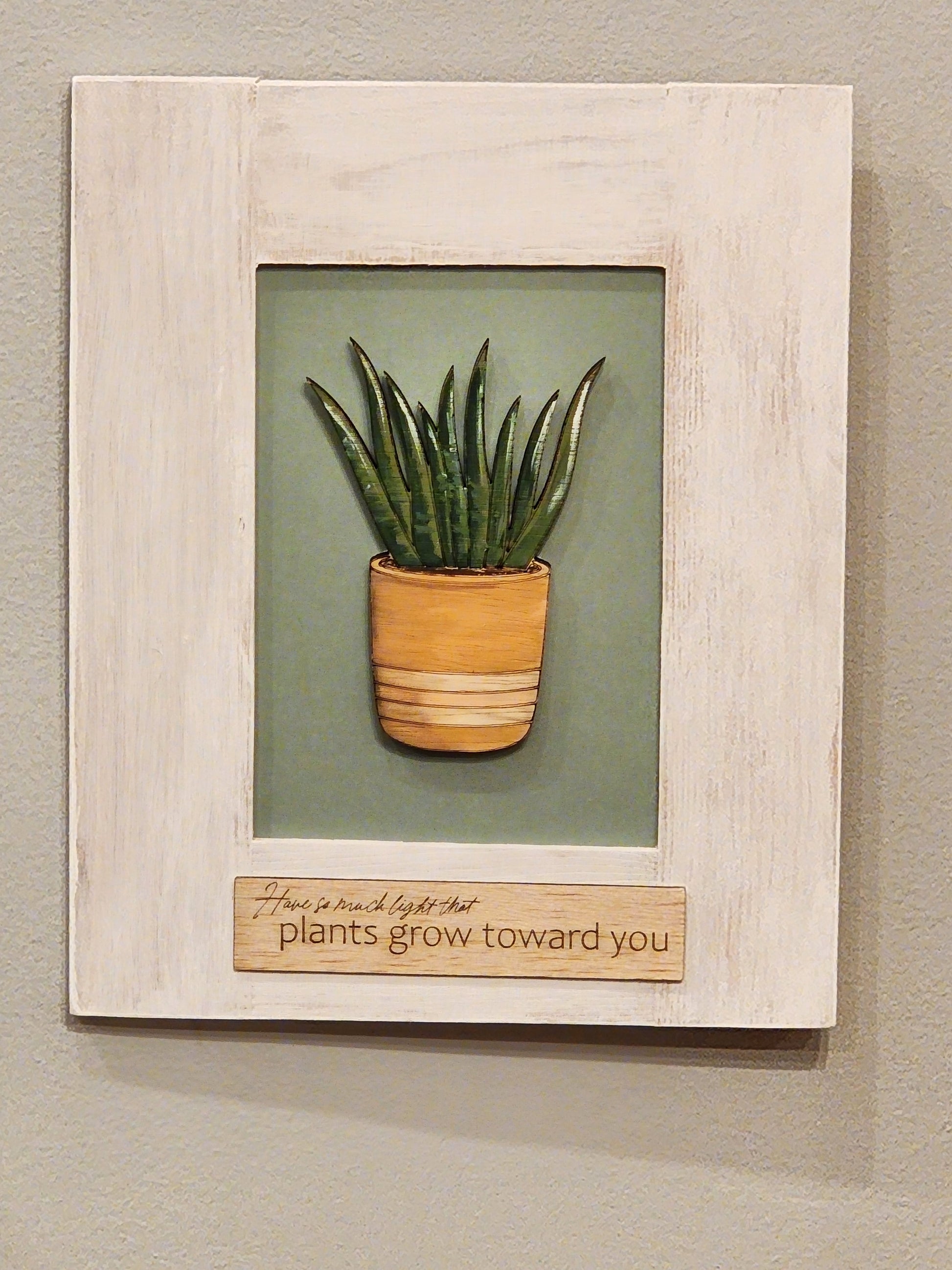 Laser cut plant, hand painted, laser cut plant phrase, painted wooden frame.