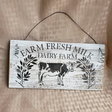 Load image into Gallery viewer, The Farm Fresh Milk Dairy Farm sign will make a delightful addition to your farmhouse kitchen with its happy little cow and florals. wire hanger adds another dimension versus regular picture hanger. Adorable small size 5&quot; x 10&quot;
