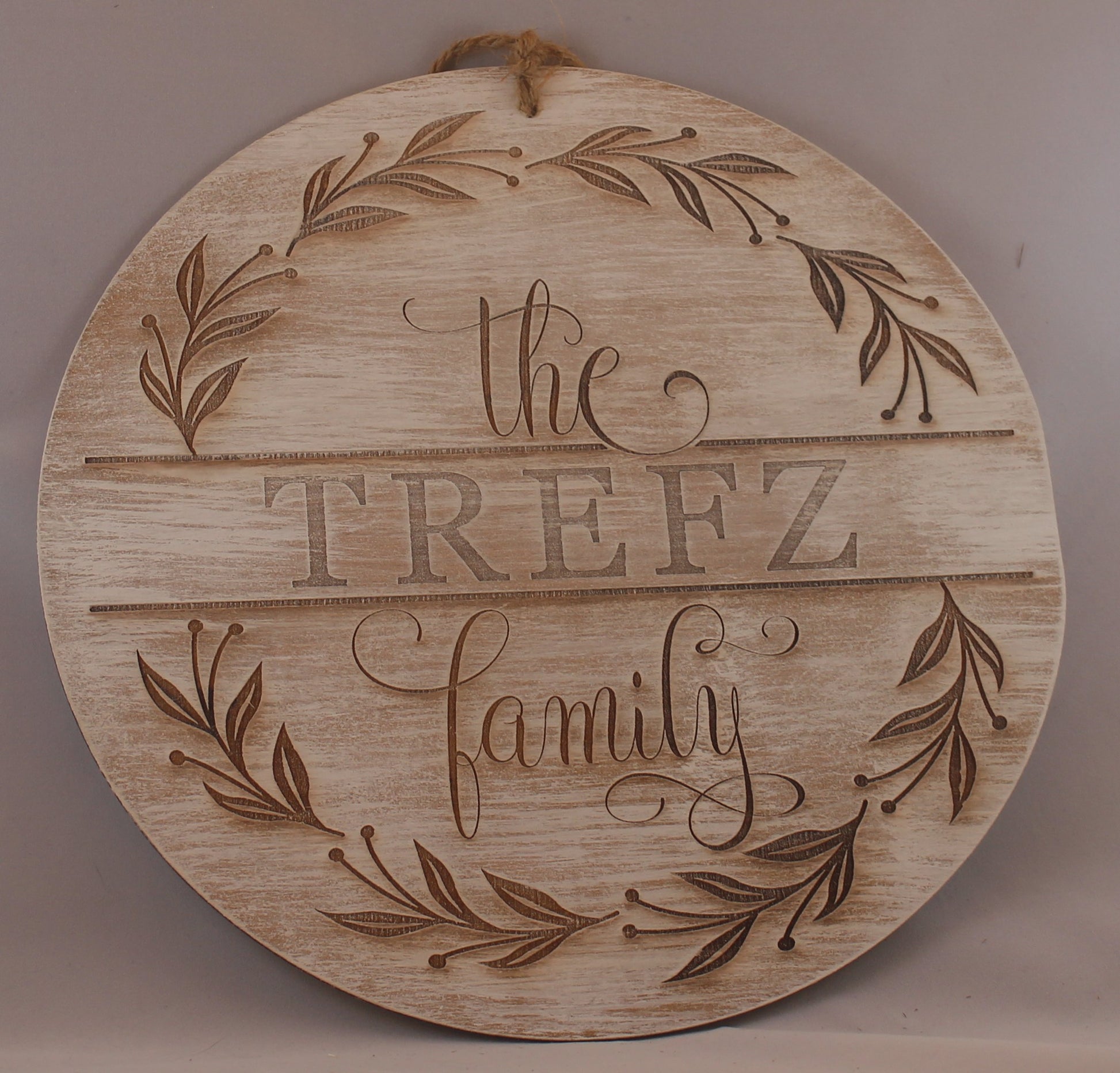 Laser engraved wood sign customized with your family name! Olive branch wreath. Script and serif fonts. option of multiple thicknesses of wood: Thin = 1/8" and Thick = 1/2". dry brushed with white paint. jute rope hanger.