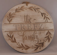 Load image into Gallery viewer, Laser engraved wood sign customized with your family name! Olive branch wreath. Script and serif fonts. option of multiple thicknesses of wood: Thin = 1/8&quot; and Thick = 1/2&quot;. dry brushed with white paint. jute rope hanger.
