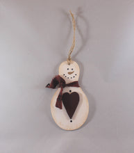 Load image into Gallery viewer, wooden hand painted snowman ornament with red fabric scarf holding heart
