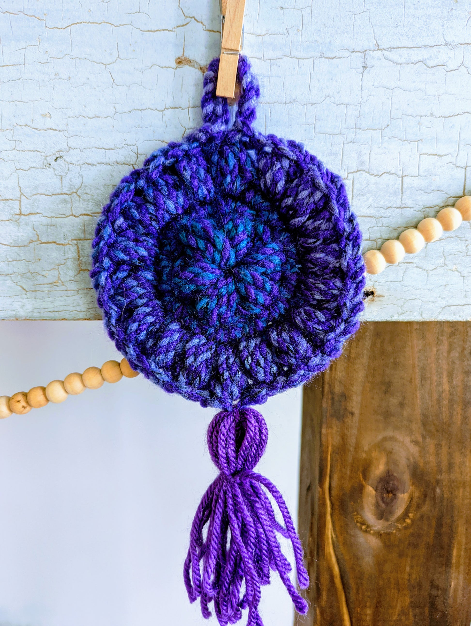 blue and purple puff stitch crochet circle dreamcatcher with tassel