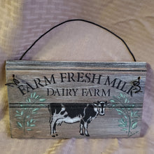 Load image into Gallery viewer, The Farm Fresh Milk Dairy Farm sign will make a delightful addition to your farmhouse kitchen with its happy little cow and florals. wire hanger adds another dimension versus regular picture hanger. Adorable small size 5&quot; x 10&quot;
