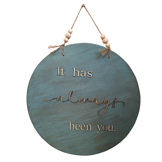 "It has always been you." Laser cut wooden letters on a vintage aqua round sign with jute rope hanger and raw wooden beads. 