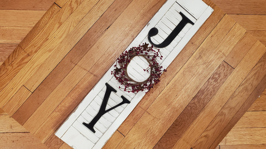 Make a shutter sign that says "JOY" to brighten your porch. Laser cut J and Y, with a small wreath for the O.