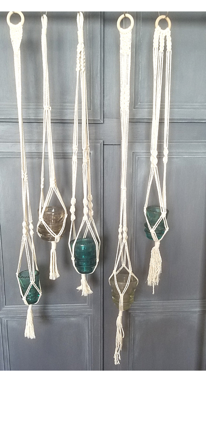 Macramé hanger with antique glass insulator. Natural color macramé rope with wooden ring hanger. Each one is unique! They are all approximately 3ft long.