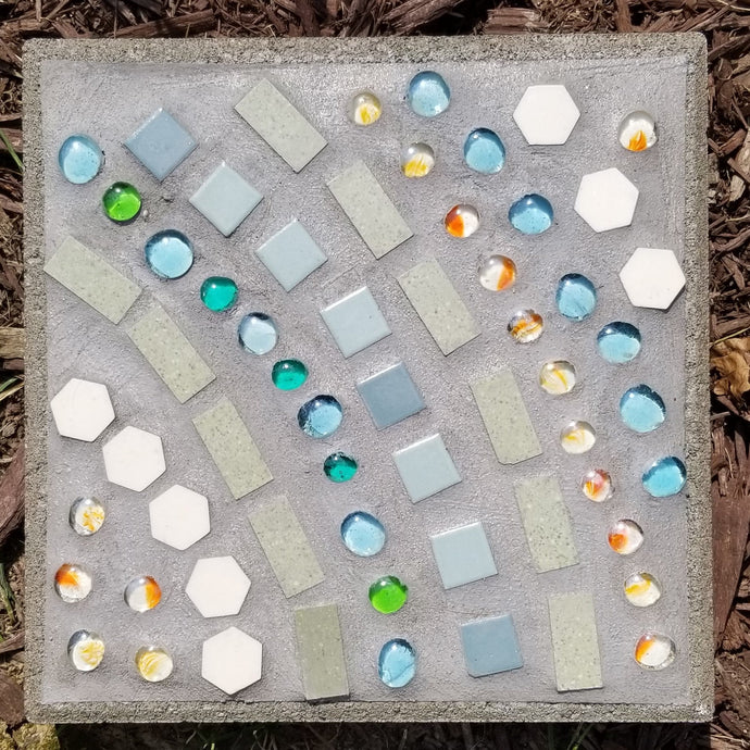 A garden stepping stone mosaic party! Choose from our many different marble and glass items to make a beautiful design for your stone. We will glue and grout and get it ready to add some sparkle to your garden!