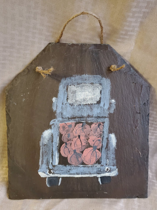 This country pumpkin truck was hand-painted on natural slate. It will add rustic charm to your farmhouse décor. Natural slate sign, medium size 11" x 12", jute rope hanger.